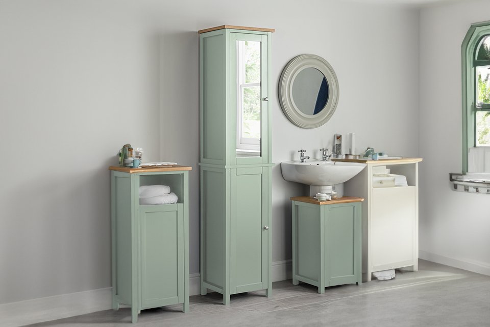 An Argos Home Livingston sage green tall boy in a bathroom.
